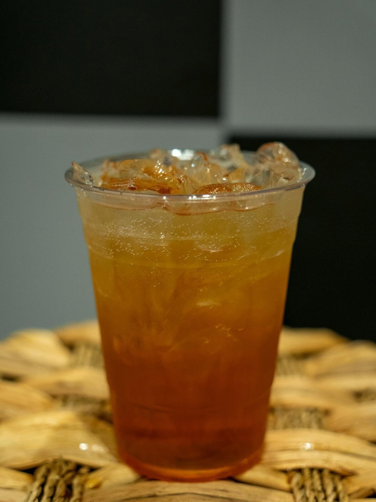 Sparkling amber iced drink over crushed ice