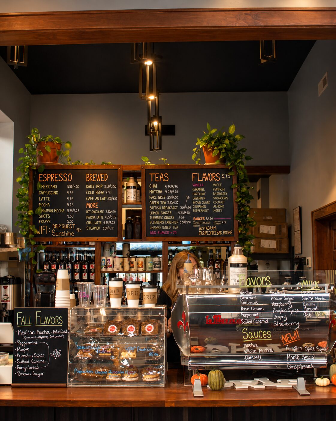 Main counter with chalkboard menus and warm lighting